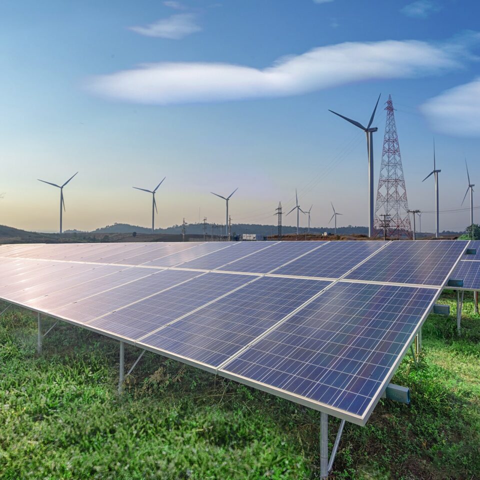 renewable-energy-solar-panels-wind-turbines-green-grass-blue-sky renewable-energy-solar-panels-wind-turbines-green-grass-blue-sky